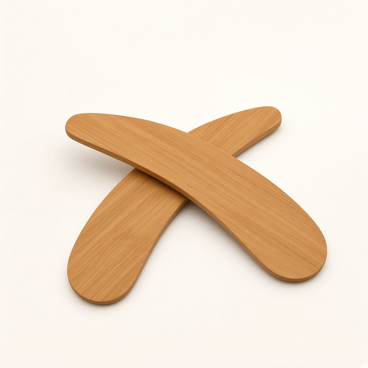 Freshie Folk bamboo applicator lying beside its silver cap on a warm off-white background.