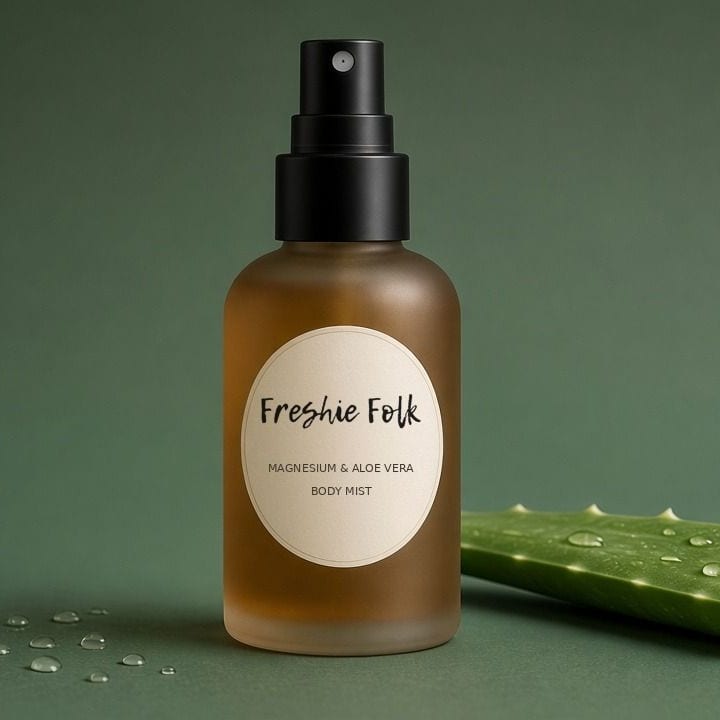 Freshie Folk Magnesium & Aloe Vera Body Mist in a frosted amber spray bottle beside fresh aloe vera
